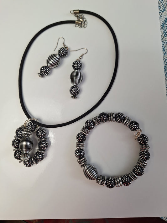 Black and silver Necklace , earrings and bracelet set.